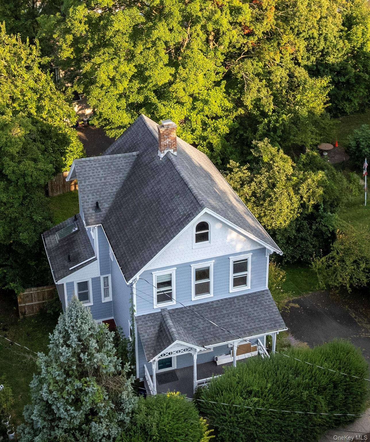 Just minutes from the Mario M Coumo Bridge, this circa 1890 Victorian offers tall ceilings, tin ceilings and timeless character that set a gracious tone.