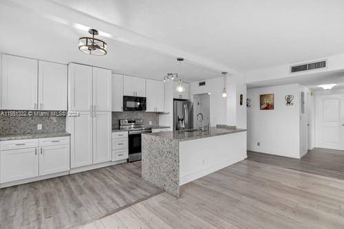 AMAZING AND BRIGHT CORNER APARTMENT LOCATED IN DESIRABLE HILLCREST AT HOLLYWOOD HILLS, THIS CONVENIENT SECOND FLOOR OFFER YOU IMPACT WINDOWS, A MODERN KITCHEN FULL OF CABINETS, STAINLESS STEEL APPLIANCES, SUBSTANTIAL ...