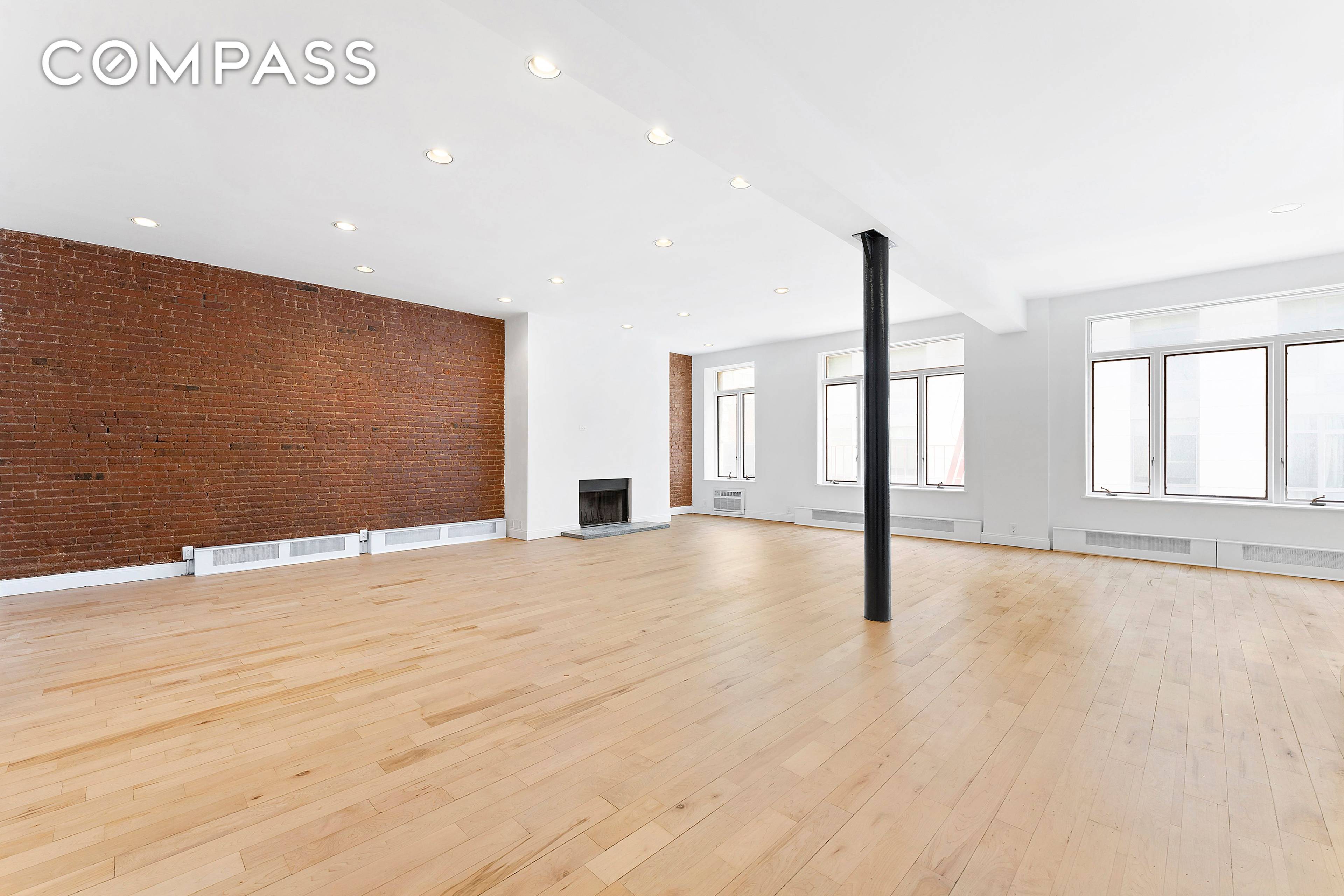 RECENTLY RENOVATED Rarely available 40 ft by 60 ft full floor loft in prime SoHo location, boasting 3 BD 2 BA, WBFP and private roof deck.