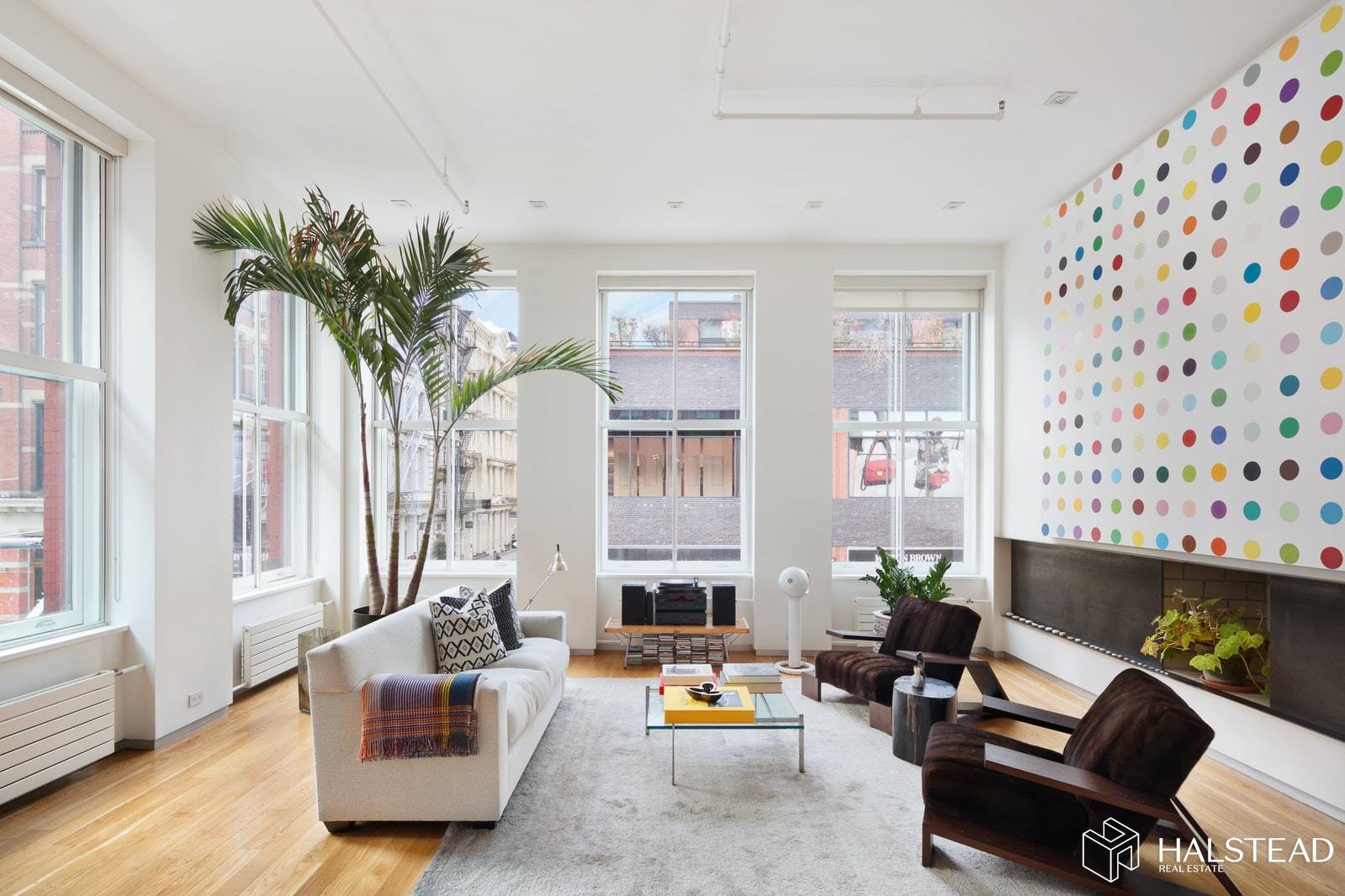 This sun blasted corner loft is located right at the epicenter of Soho and features grand scaled rooms, soaring ceilings and open views of the surrounding historic district from 14 ...