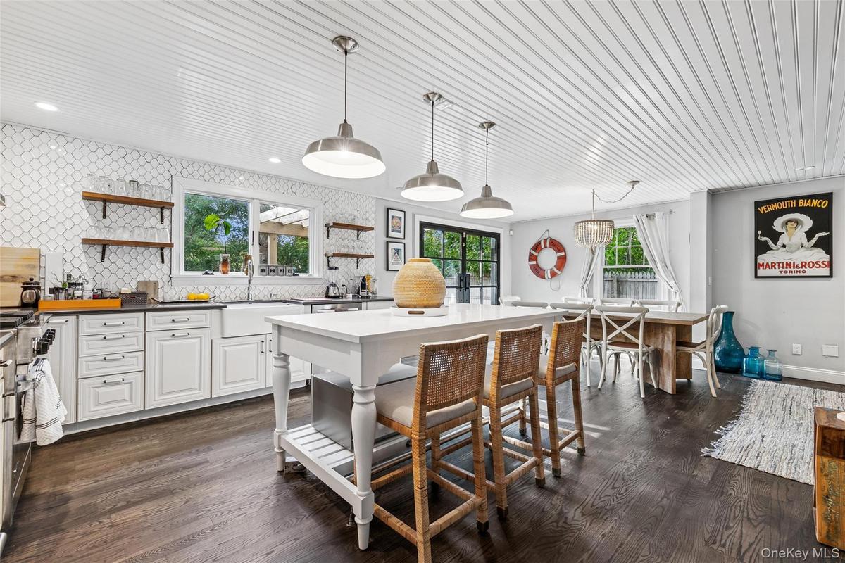Kitchen featuring open shelves, tasteful backsplash, pendant lighting, dark wood-style flooring, and recessed lighting