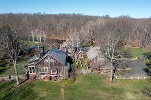 Unsurpassed Washington, CT Estate on 104 magical acres featuring open meadows, stone walls, mature garden, ponds distant views situated off a scenic dirt road.