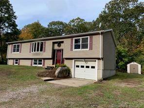 Welcome home to this bright and open expanded raised ranch in Stonington on 1.