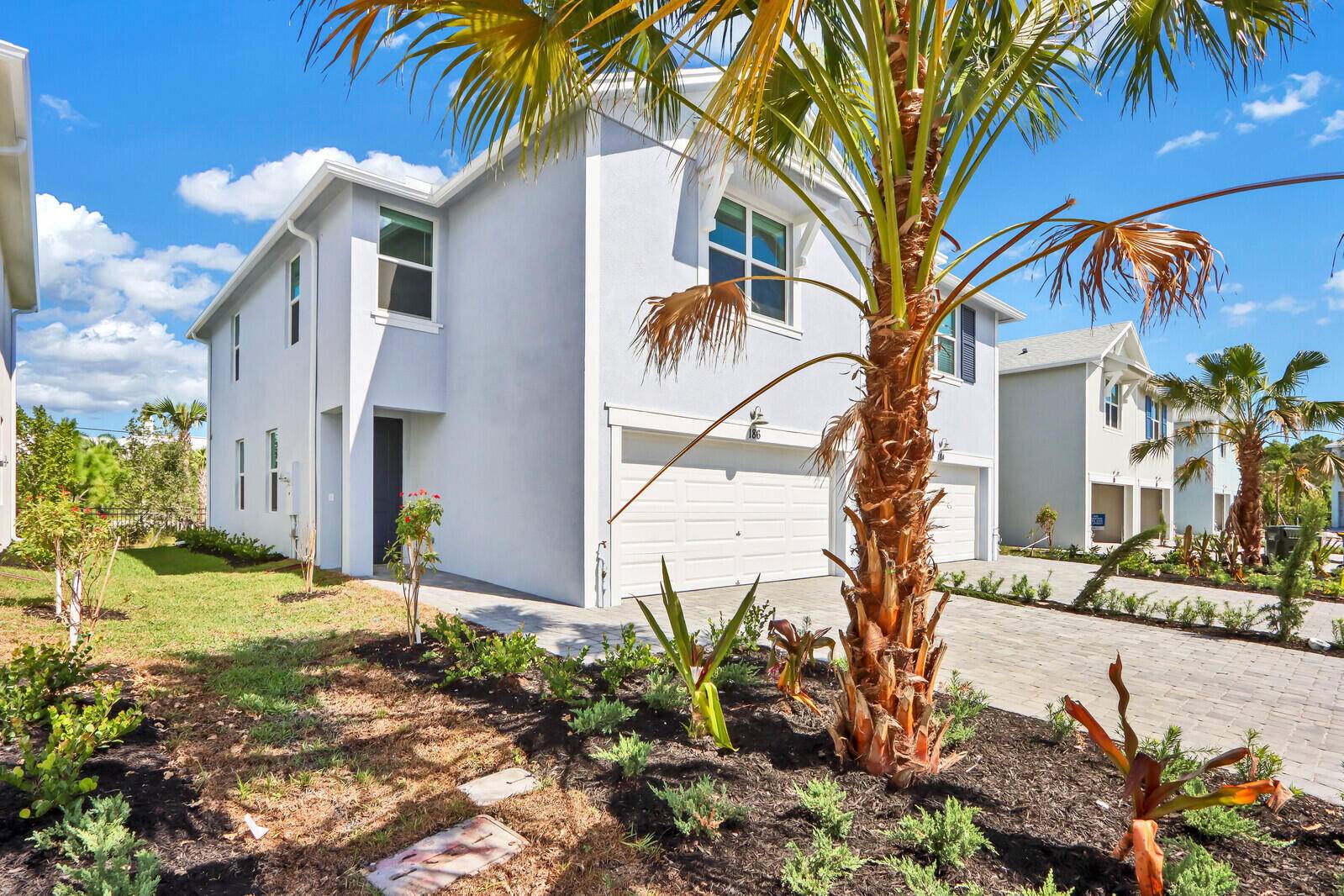 Welcome home to this freshly constructed, energy efficient townhome nestled in the vibrant heart of Jensen Beach.