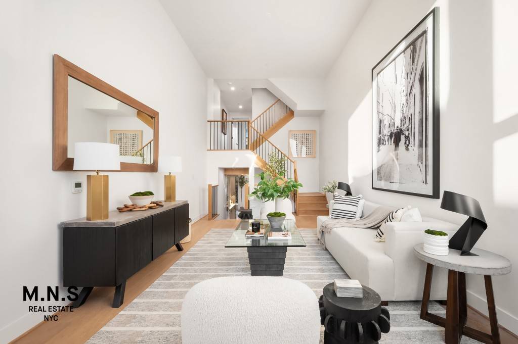 Set among a collection of four sprawling townhomes on a charming, tree lined street in the Columbia Street Waterfront District of Brooklyn, this Summit Street townhome features private parking, ample ...