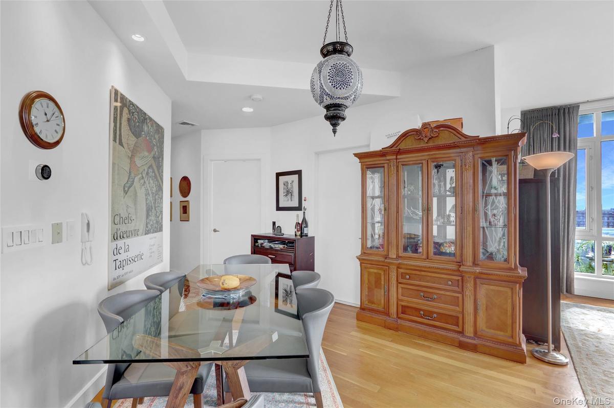 Dining space featuring recessed lighting, a healthy amount of sunlight, light wood-type flooring, and visible vents