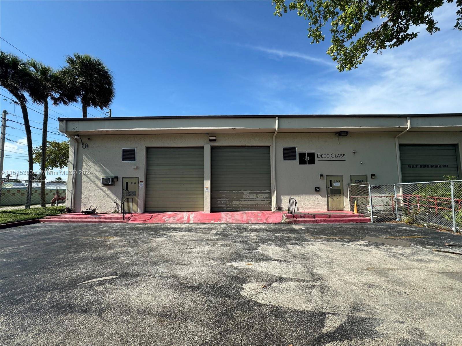 Large open warehouse space with 2 bathrooms and a portion of built out office space with central AC.