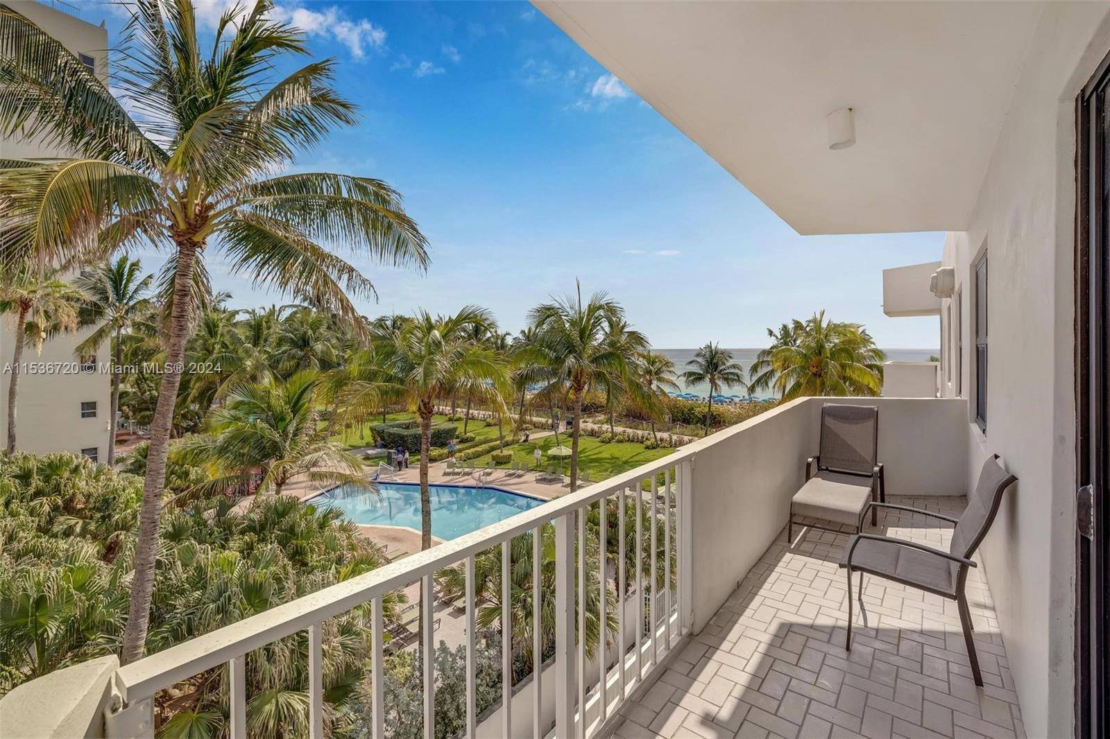 Sunlit beachfront condo featuring a spacious balcony with an ocean view, washer dryer in unit, renovated kitchen and bathrooms, tile floor throughout, a walk in closet in the bedroom, and ...