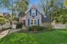 View of front of home featuring roof with shingles