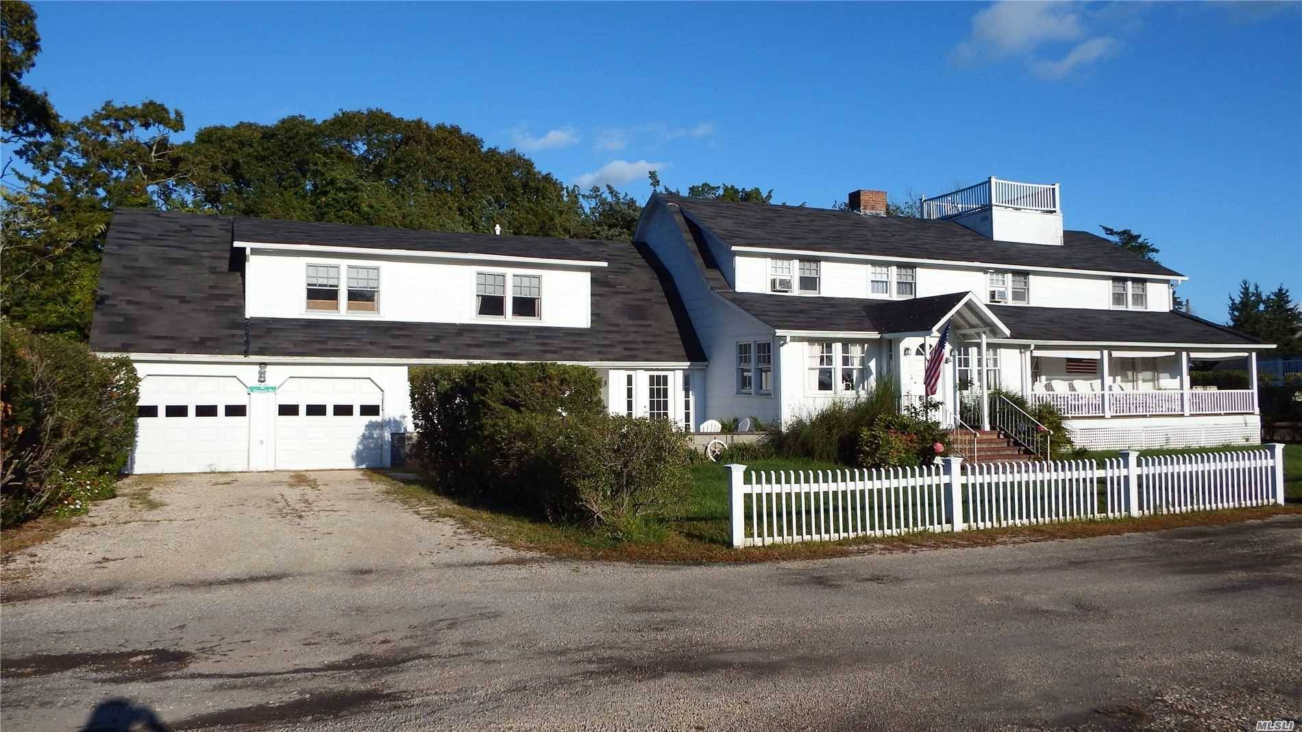 Classic 1936 Captains Cottage on the largest lot in a cozy beach community on Shinnecock Bay.
