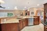 Custom Kitchen: Prep Sink, Snackbar, Custom Cabinets with under and over lighting, Hybrid Induction Cooktop, Hidden walk-in pantry