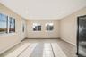 Foyer with light tile patterned floors, recessed lighting, and a baseboard radiator