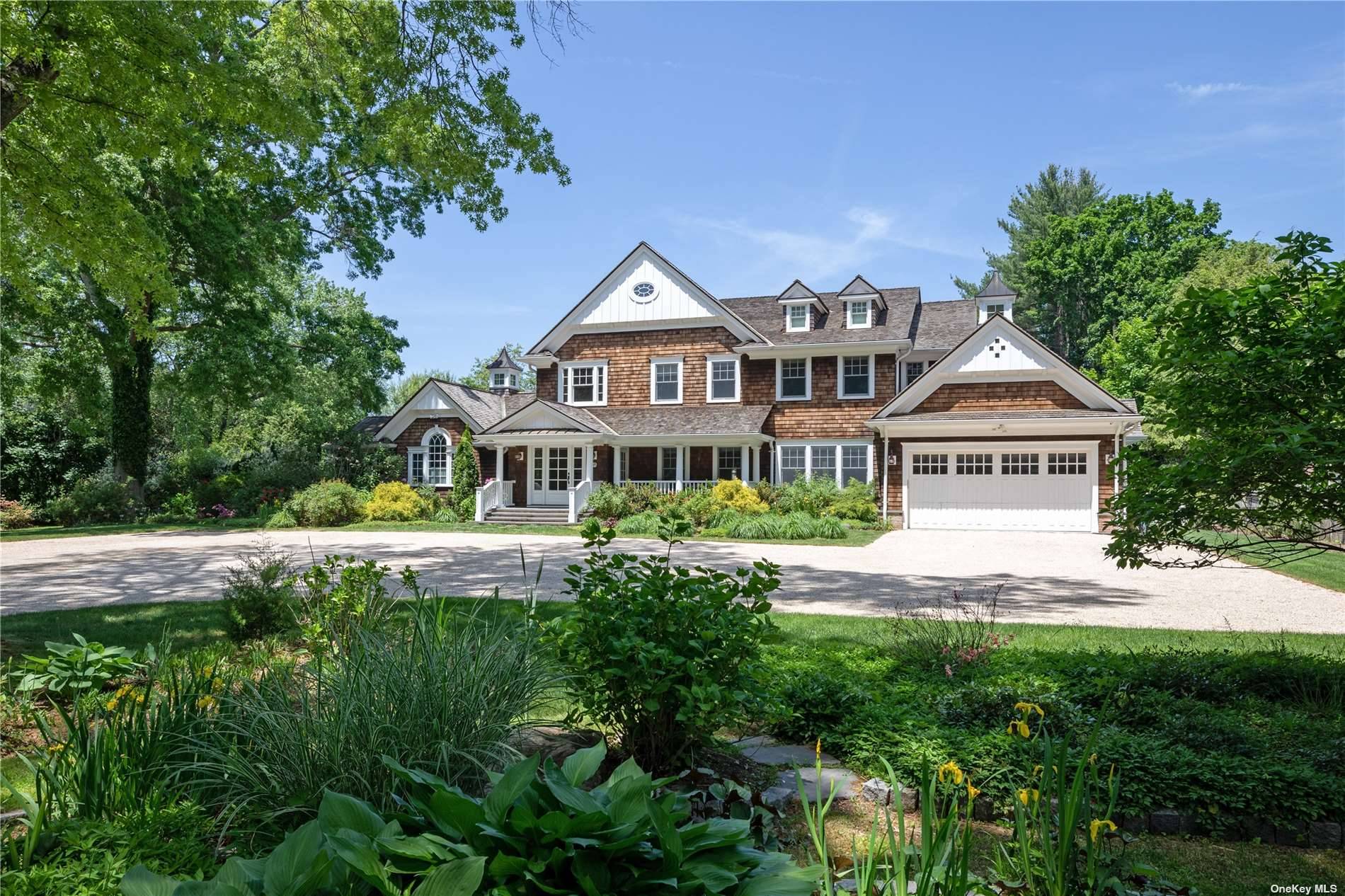 Stunning Hamptons style shingle home in the heart of the North Shore.