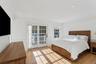 Bedroom featuring access to exterior, crown molding, light wood floors, and recessed lighting.