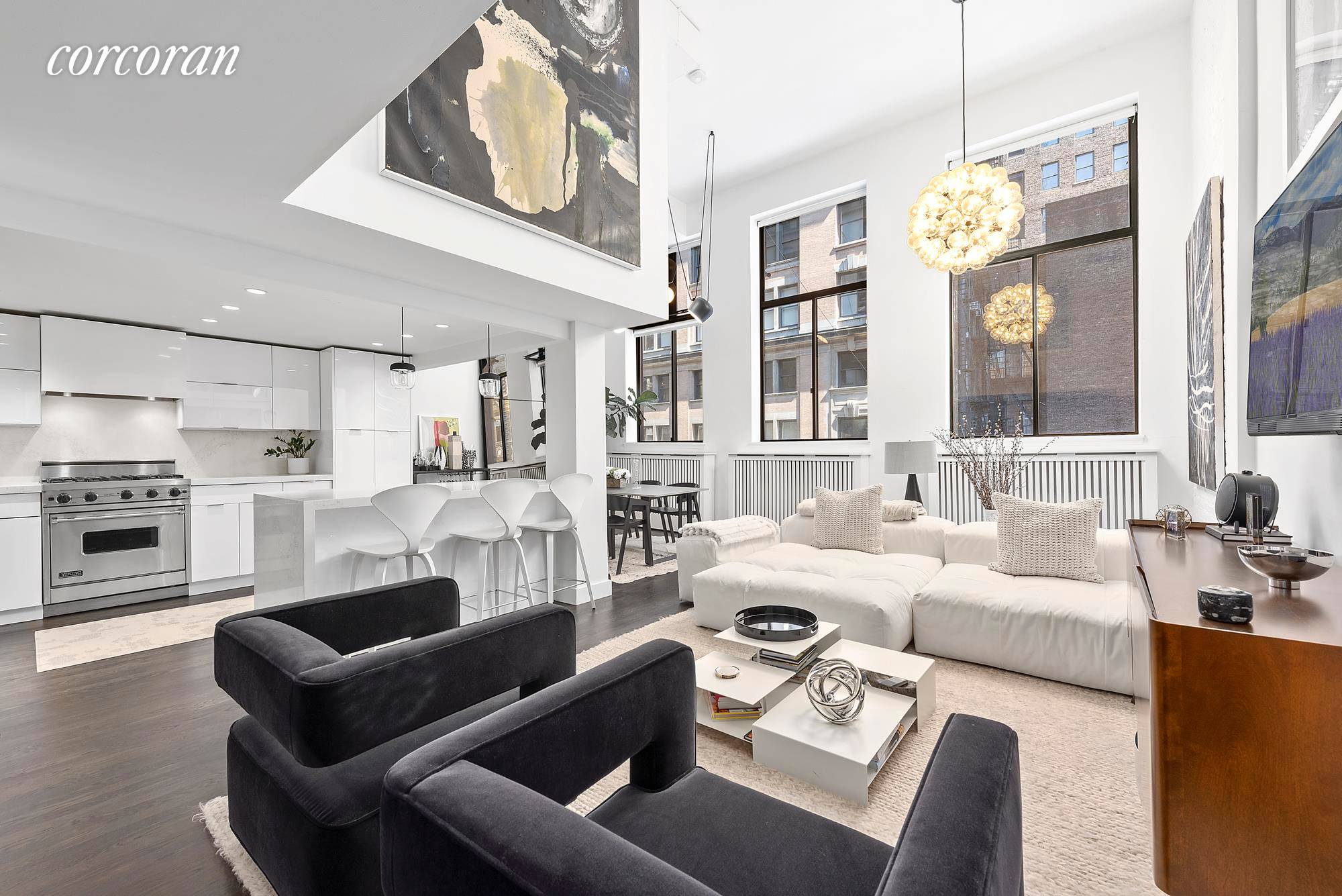 Sleek minimalist design and expansive living space define this light filled, meticulously renovated three bedroom, two bathroom duplex loft in a historic Flatiron cooperative.