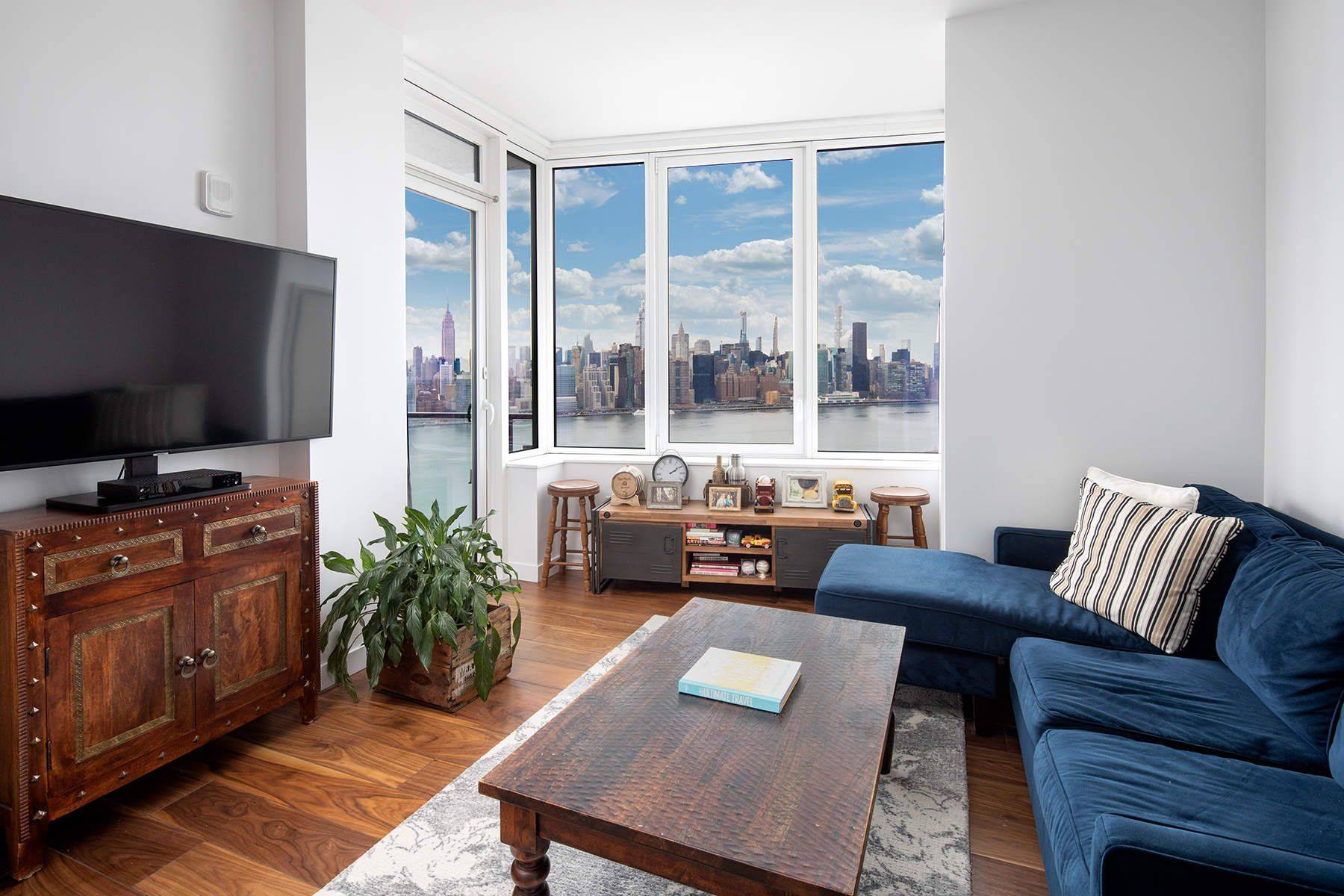 First resale at The Greenpoint condominium tower residences bright corner 1BR aerie with private balcony.