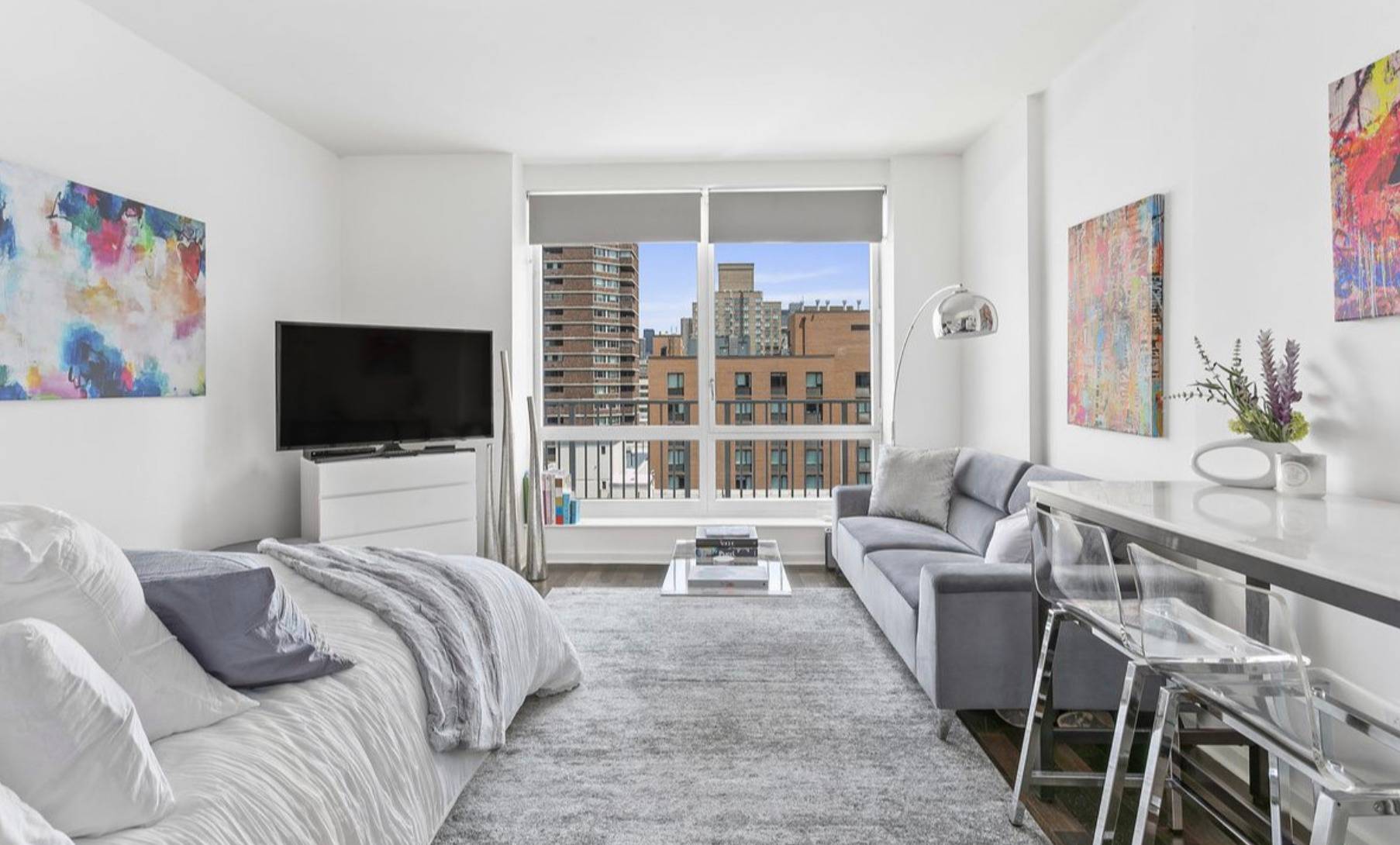 In triple mint condition, stunning studio designed by famous designer and architect, Philippe Starck features floor to ceiling windows with EMPIRE STATE VIEWS !