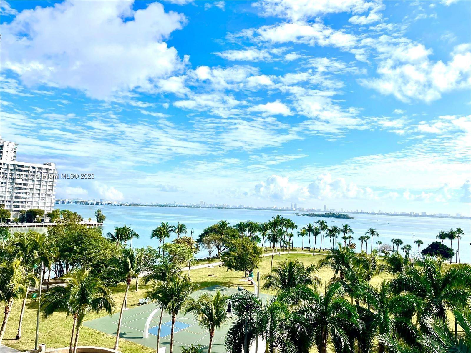 Incredible 1 Bed 1 Bath Loft with 14' ceilings with desirable open floor plan looking over Biscayne Bay and Margaret Pace Park.