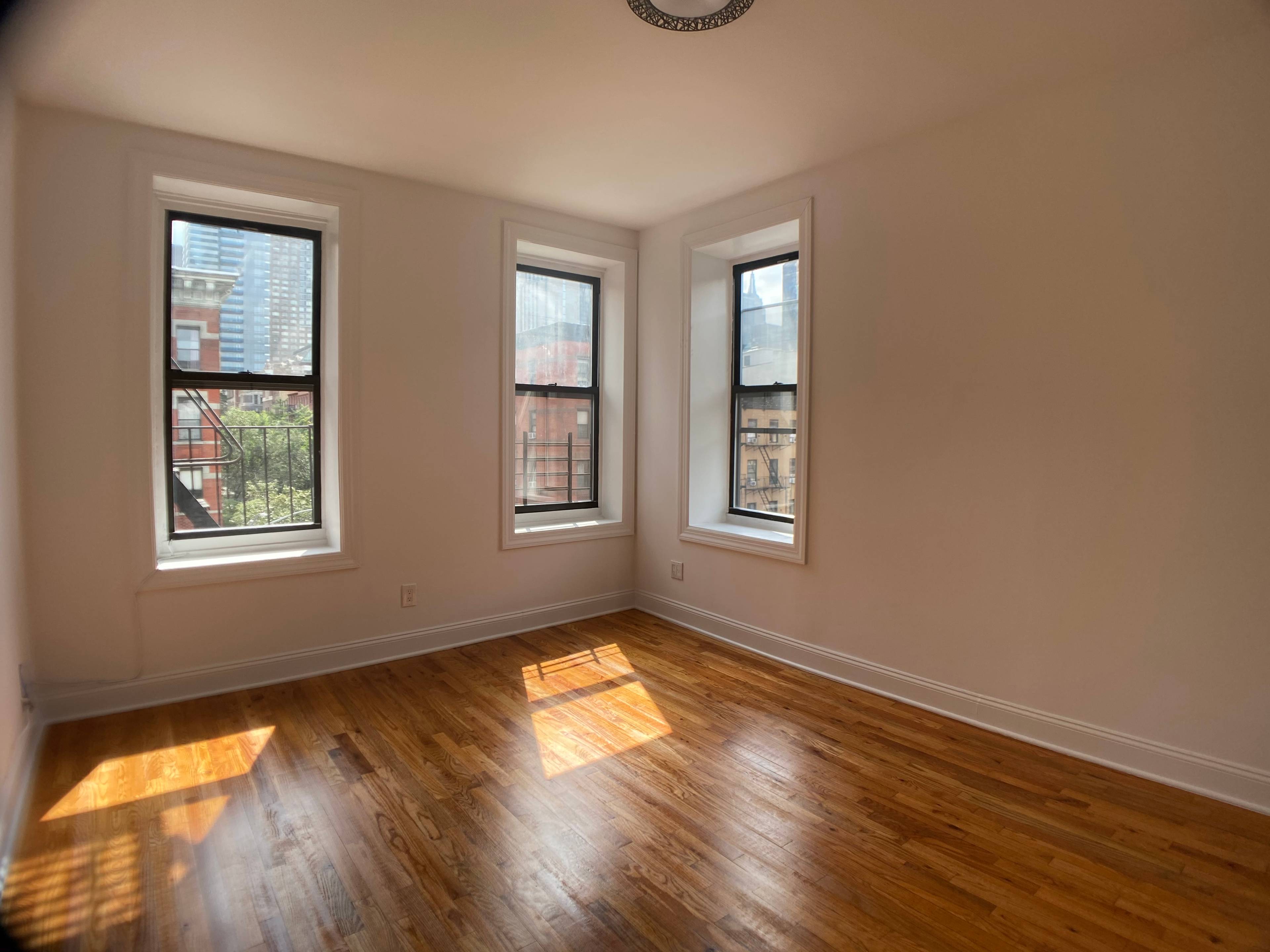 BEAUTIFUL MIDTOWN WEST HELL'S KITCHEN 2 BEDROOM with PRIVATE WORKSPACE Separate third room South facing, corner unit with tons of natural light !