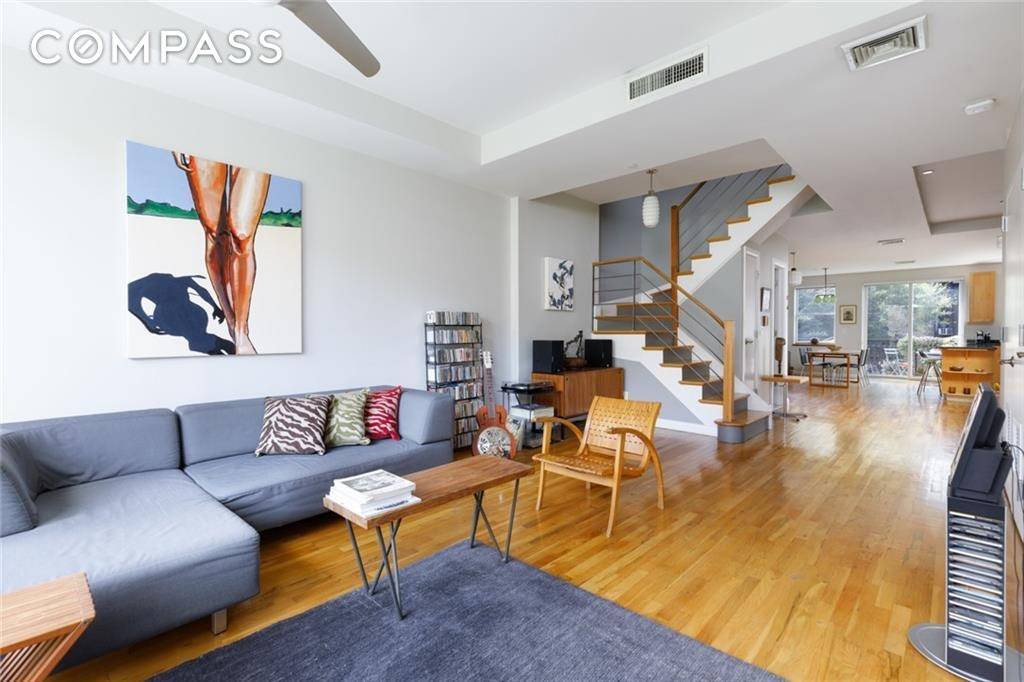 The top two floors are home to this modern, sleek and sunny duplex condo.