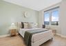 Bedroom with light wood-style floors