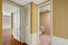 Hallway between bedrooms with powder bath