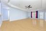 Living Room featuring a raised ceiling, crown molding, light wood-style floors, ceiling fan, and recessed lighting