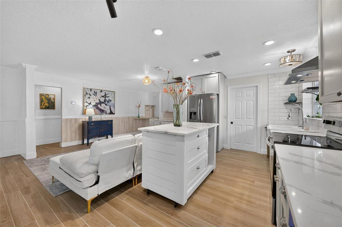 Kitchen opens to one of two living areas