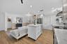 Kitchen opens to one of two living areas