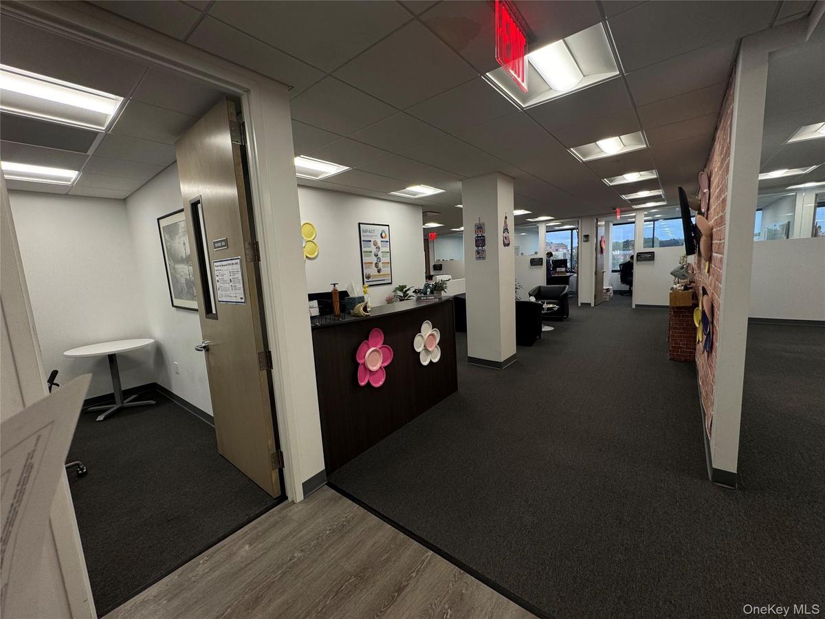 Reception featuring a drop ceiling