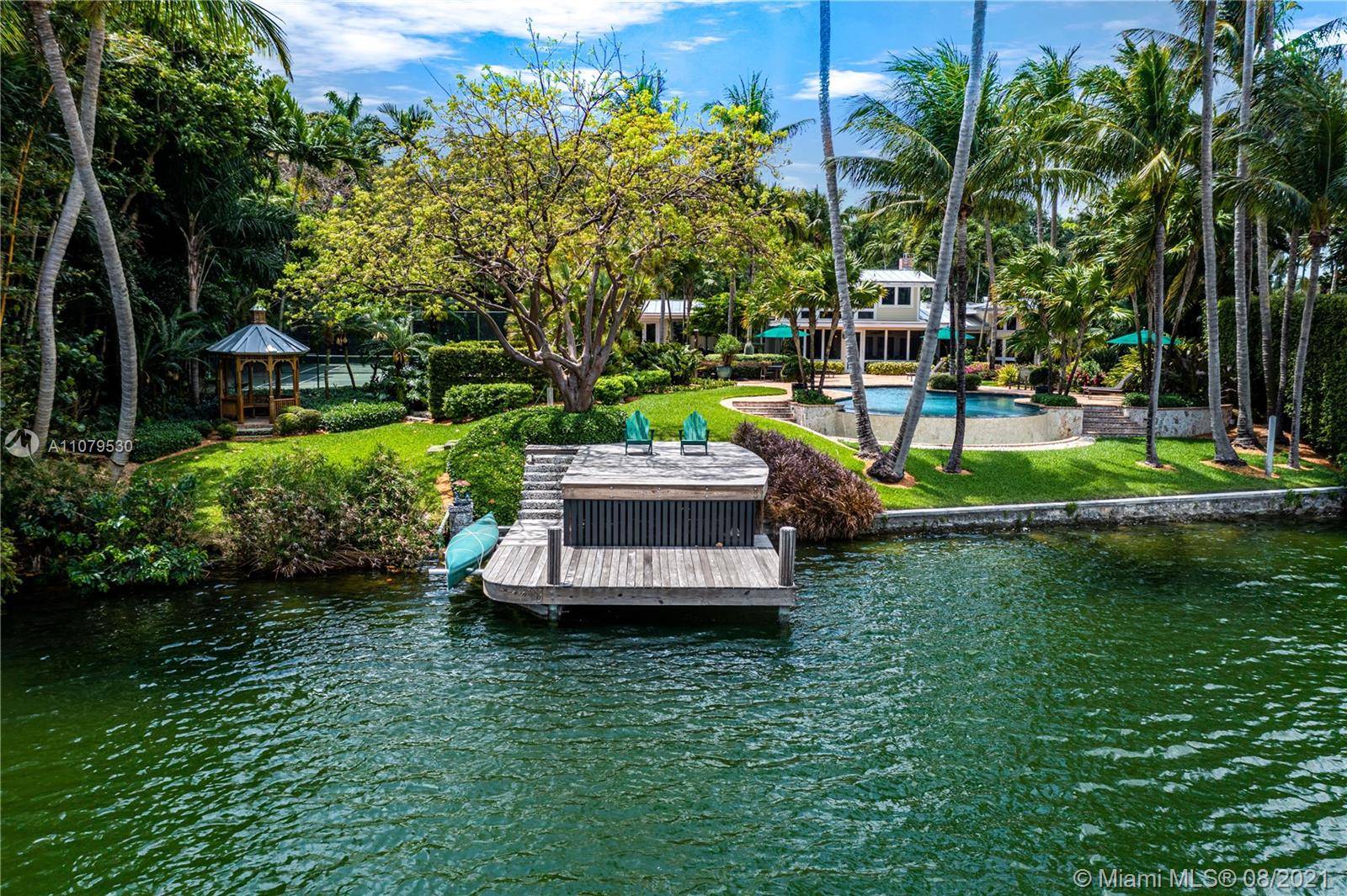 Situated in Hammock Lakes, one of the most desirable gated communities in Coral Gables, this gorgeous 6, 427 Sq.