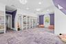 Recreation room with crown molding, light colored carpet, and recessed lighting