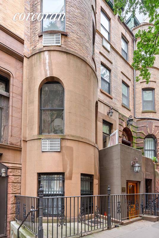 Opportunity knocks. This turn of the century brick and terracotta brownstone with large bay windows and multiple outdoor spaces is on a tree lined street of well maintained row houses.