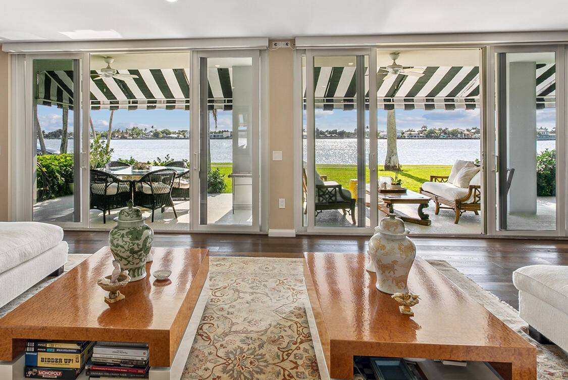 DIRECT WATERFRONT ground floor rare and exceptionally renovated in 2020, this 4 bedroom 4 bath, double sized condo unit opens to expansive lanai, beautifully maintained Chateau Cheverny lawn and panoramic ...