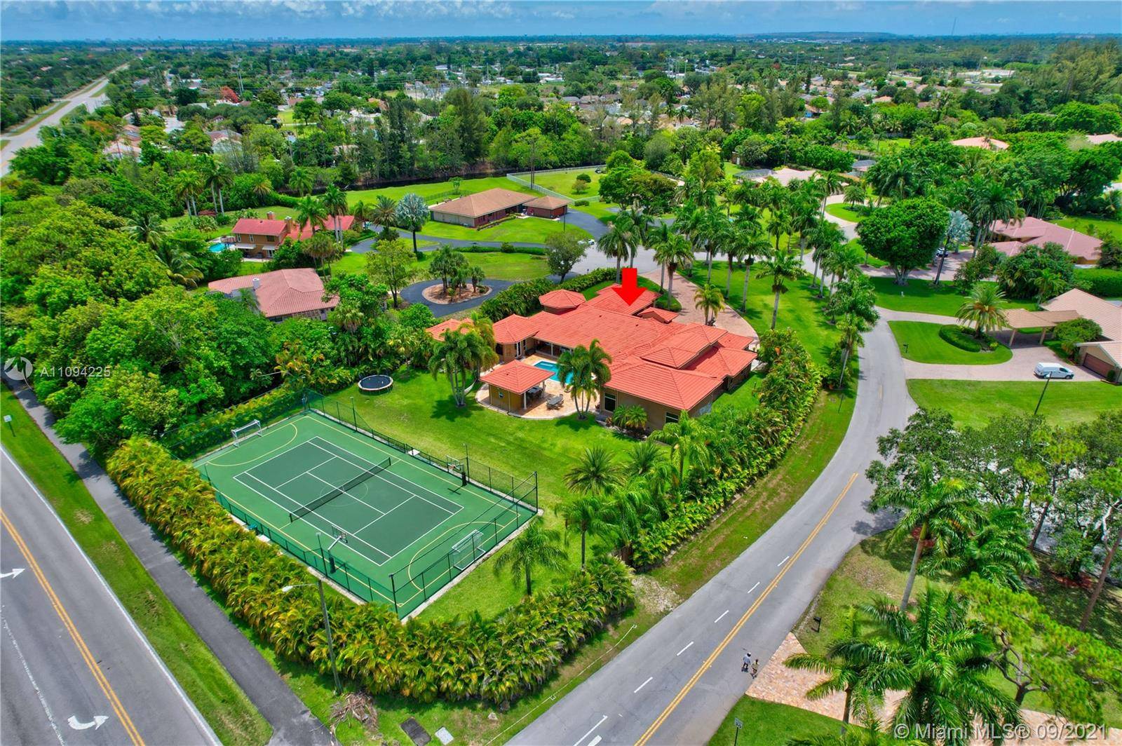 Spectacular 7, 255 sq ft custom estate in West Boca Raton with PRIVATE TENNIS court situated on a pristine 1.