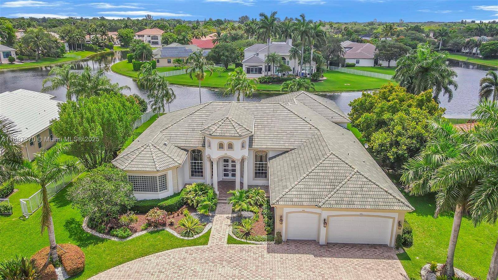 Discover refined elegance in this exceptional estate home, perfectly situated in the prestigious 24 hour guard gated community of Stonebrook Estates.