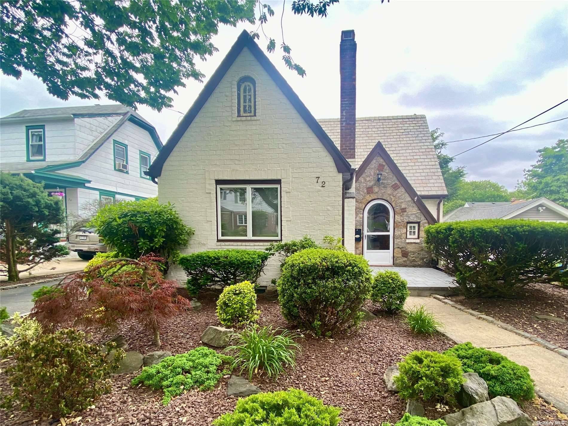Classic tudor cape style home located in the West End Section of The Village of Floral Park.