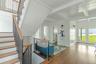 Stairs featuring wood finished floors, french doors, and beam ceiling