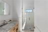Bathroom with walk in shower and vanity