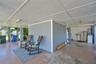 Ground-level covered area providing flexible recreation and storage space.