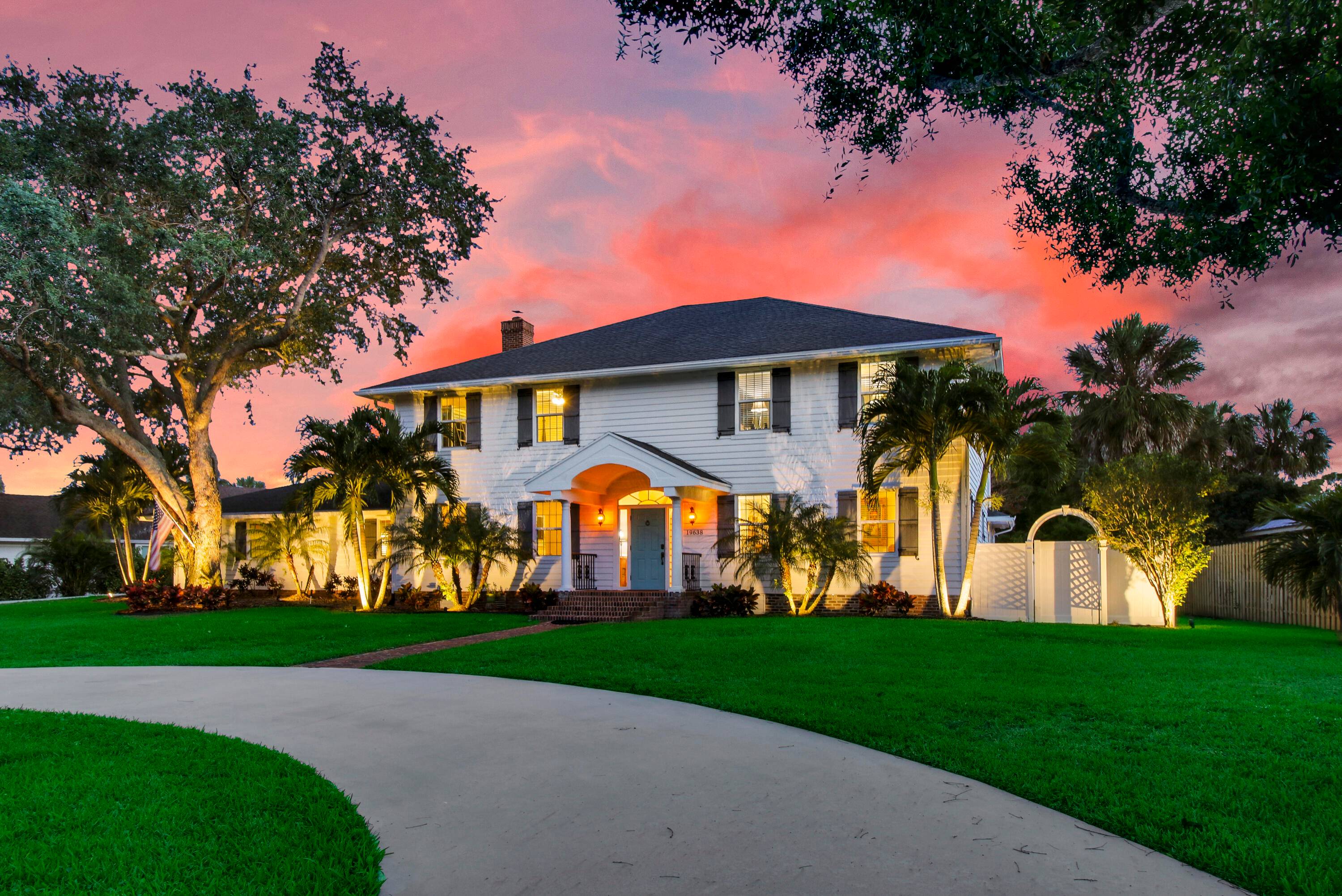 This extraordinary Colonial style home with 4000 SqFt of living is located in the picture perfect Jupiter community of Whispering Trails.