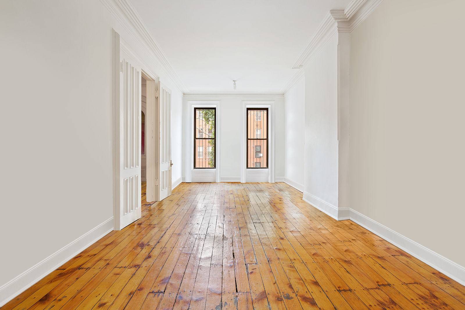 Elegant 20' wide Clinton Hill brownstone adjacent to the Historic District with 10'11 ceilings on the grand parlor floor.