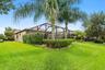 Lush, Landscaped Backyard with a Private Screened Pool