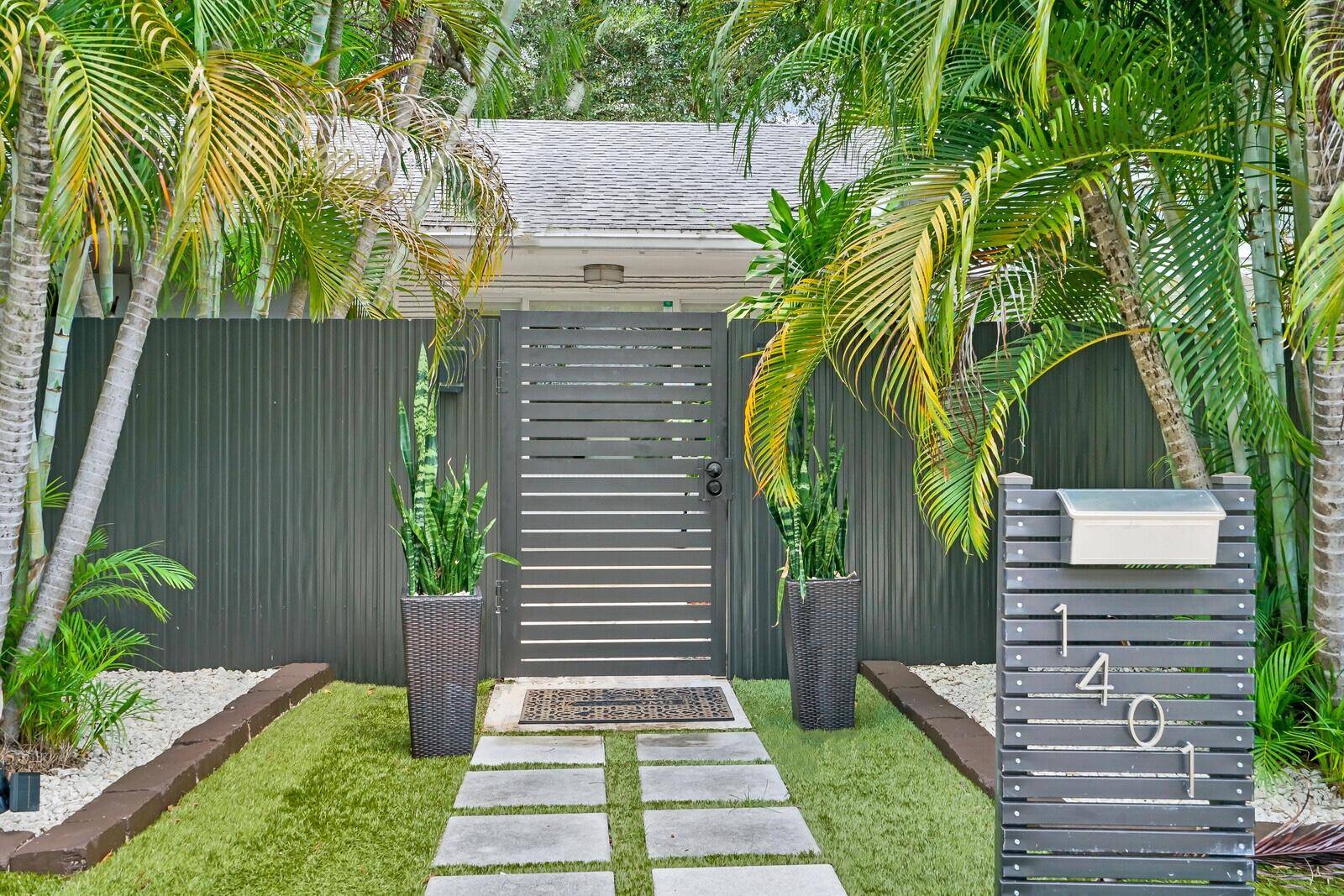 Enjoy views of lush tropical greenery and privacy here in this uniquely adorable bungalow style home.