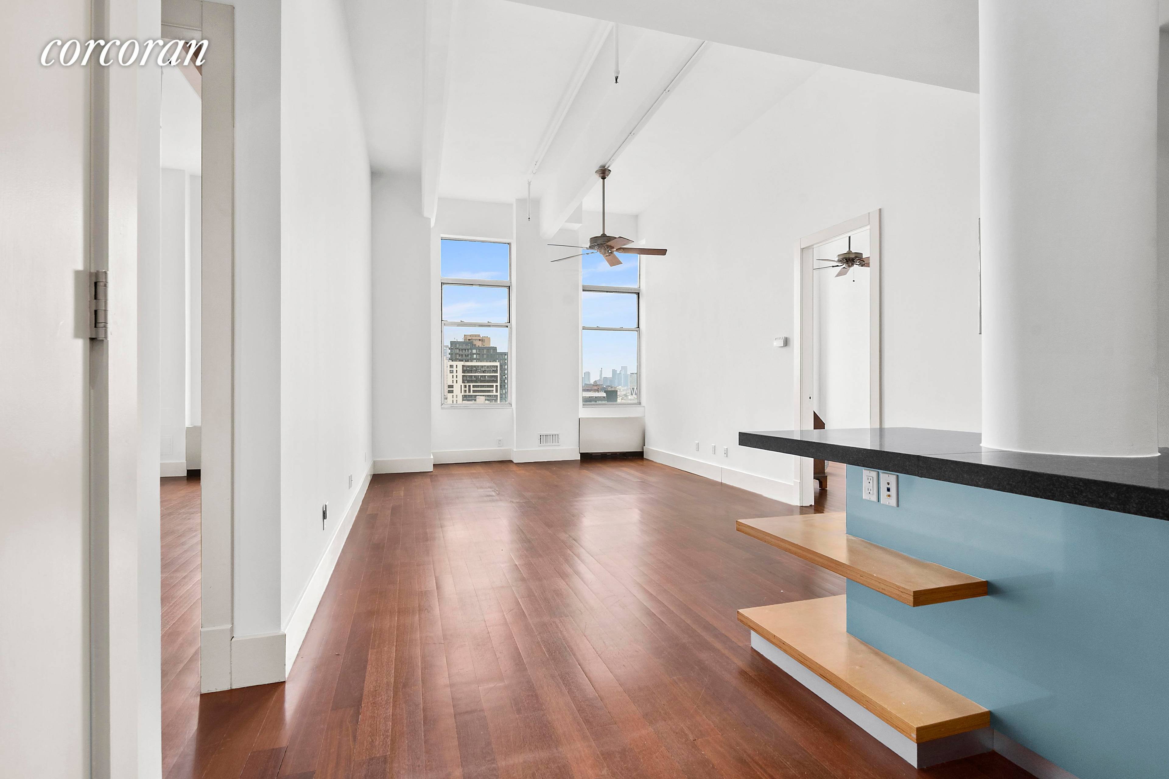 Direct City VIEWS in this Massive Split Two Bedroom Loft on the 10th floor located in the renowned Karl Fischer designed Gretsch condominium building in Williamsburg.