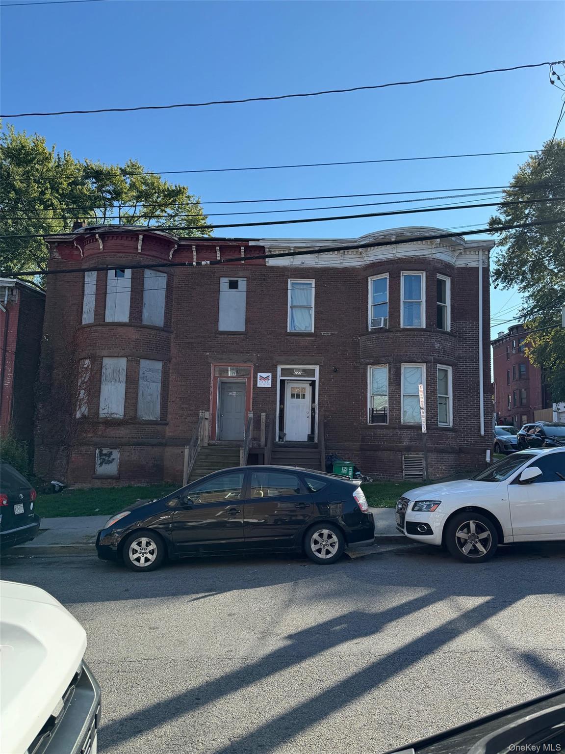 View of front facade featuring brick siding