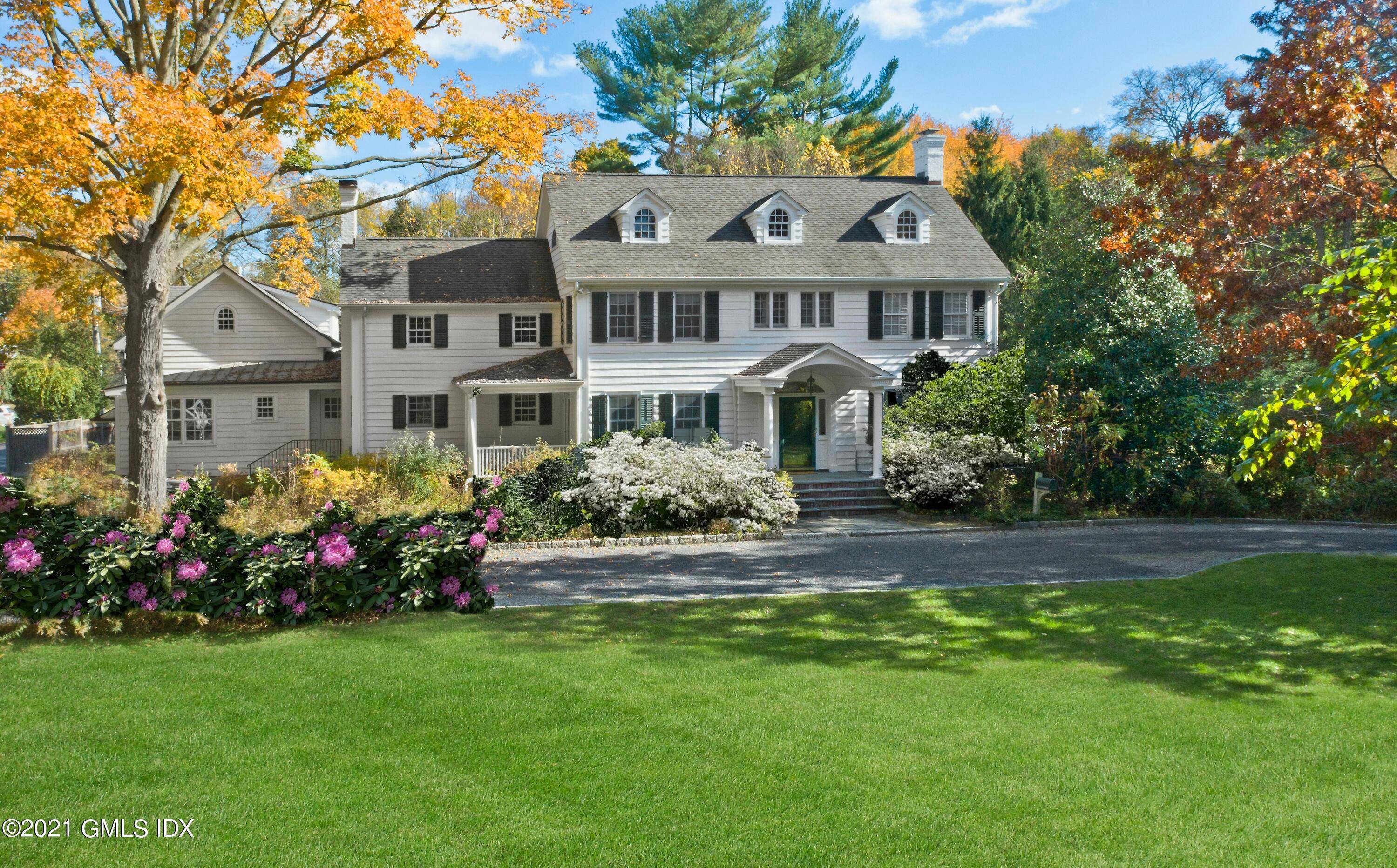 Greeted by stone pillars circular driveway this classic colonial w elegant spaces beautifully blends w casual living.