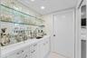 Wet Bar with Laundry Room Beyond