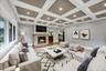 Second Living Room with beautifully decorated ceilings featuring recessed lighting, second fire-place and large windows throughout. Furniture has been