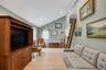 Vaulted ceilings defining a spacious living area with light wood-finish flooring